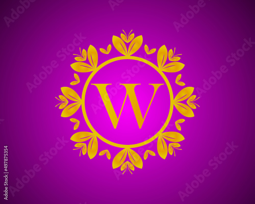 Fototapeta Naklejka Na Ścianę i Meble -  Alphabet W luxury logo design with gold color gradation and gold leaf circle suitable for bathing, hotel, beauty and grooming. against a violet VelVet background.