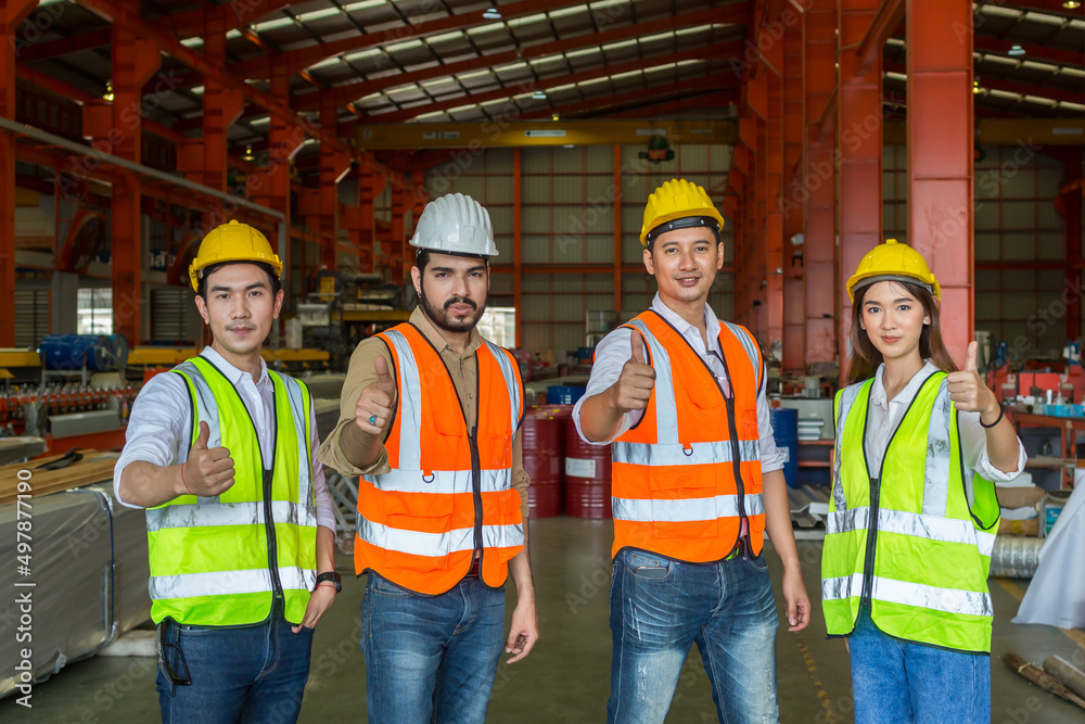 Team Foreman or Team worker work at factory site check up machine or products in site. Team Engineer or Team Technician checking Material or Machine on Plant. Heavy industry factory concept.