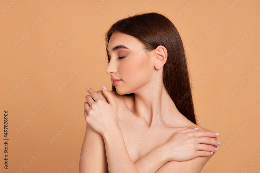 woman touching her shoulder and enjoying perfect soft clean skin woman touching her shoulder and enjoying perfect soft clean skin