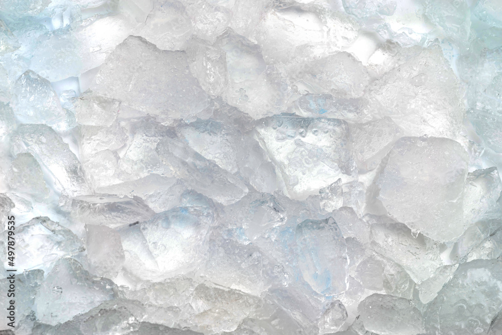 Abstract ice texture. Icy chunks on the surface. Top view close up. Fragments of crystals of irregular shape