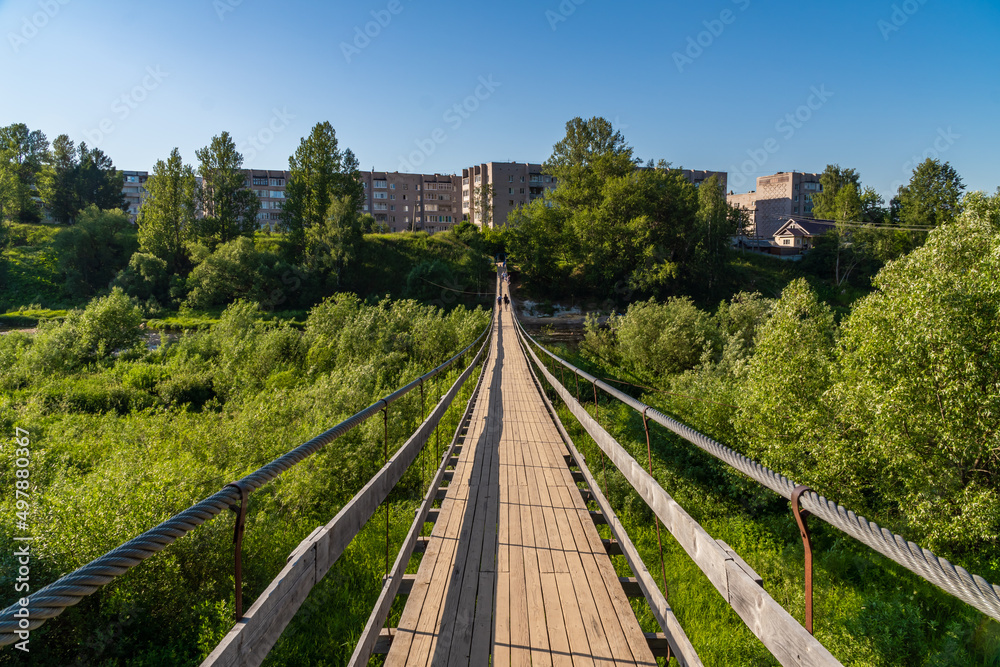 Russia. June 20, 2021. Hanging rope bridge across the Msta River in Borovichi. Russia. June 20, 2021. Hanging rope bridge across the Msta River in Borovichi.