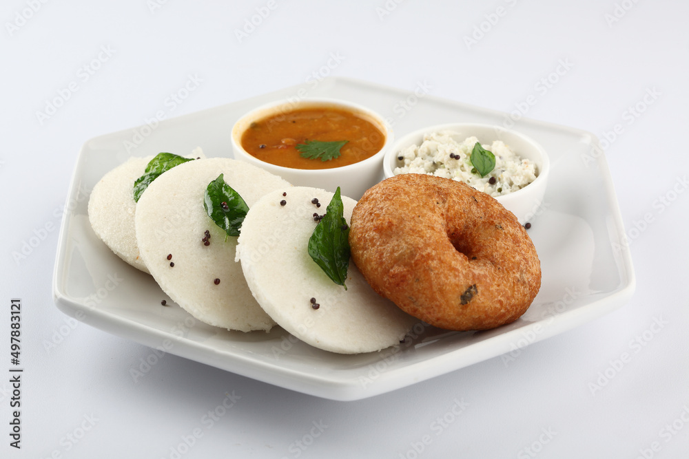 South Indian Breakfast menu, Idly Vadai with coconut chutney and sambar, served in a white Ceramic plate