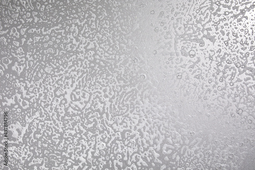 Texture of white soap foam with bubbles abstract grey background, Soap, shower gel, shampoo, Face Cream cleansing mousse sample.