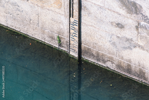 River water level meter in Torino, Italy, Po river, drought concept