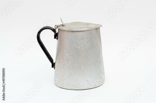 Vintage metal milk jug isolated
