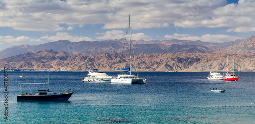 Pleasure and cruise tourist boats in the Red Sea, near coral reefs, Middle East