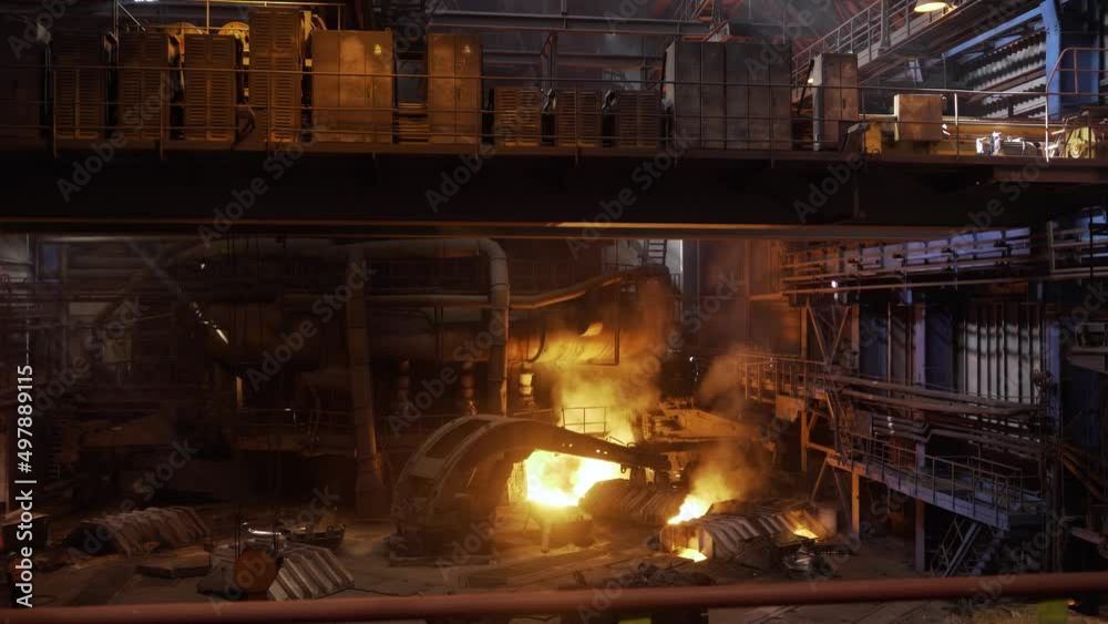 Molten metal pouring, metallurgy, steel casting foundry. Industrial landscape inside the hot shop for melting metal. Working blast furnace at the metallurgical plant, heavy industry concept. Molten metal pouring, metallurgy, steel casting foundry. Industrial landscape inside the hot shop for melting metal. Working blast furnace at the metallurgical plant, heavy industry concept.