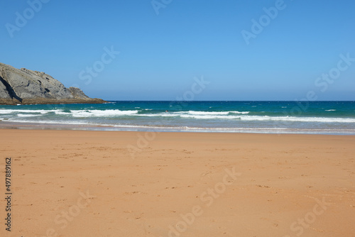 A quiet beach with a turquoise blue sea