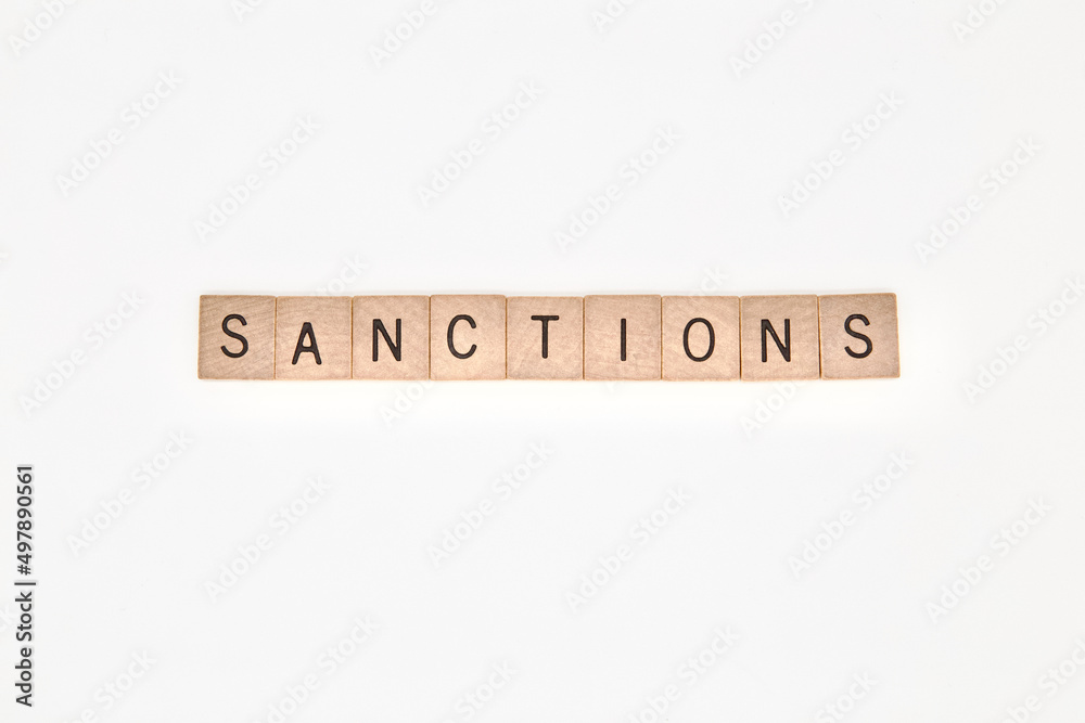 Wooden cubes with words sanctions on a wooden holder Wooden cubes with words sanctions on a wooden holder