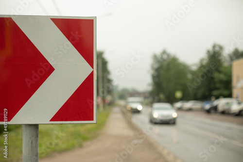 Sharp turn sign on road. Place of sharp bend in road.
