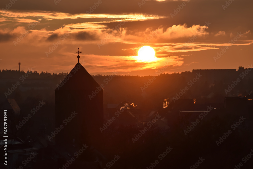 View on Freiberg in Germany with the silhouette of the Donatsturm. A medieval defence tower during sunset.