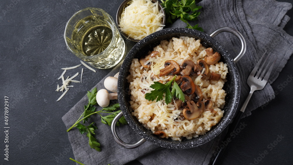 Mushroom risotto garnished with parsley  and parmesan.