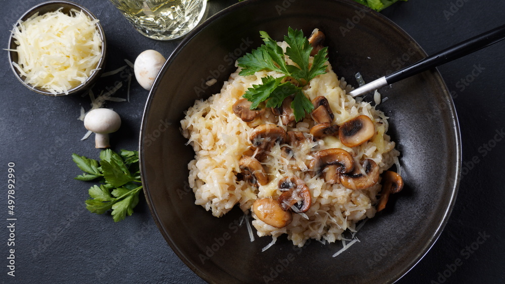 Mushroom risotto garnished with parsley and parmesan. Mushroom risotto garnished with parsley and parmesan.