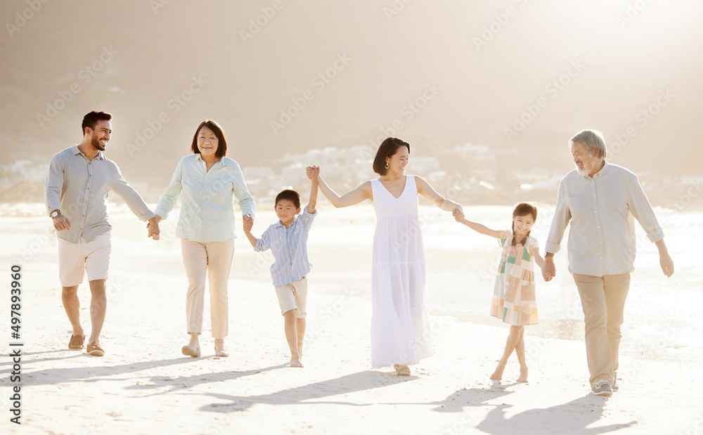 Naklejka premium The beach, fun for the whole family. Full length shot of a happy diverse multi-generational family at the beach.