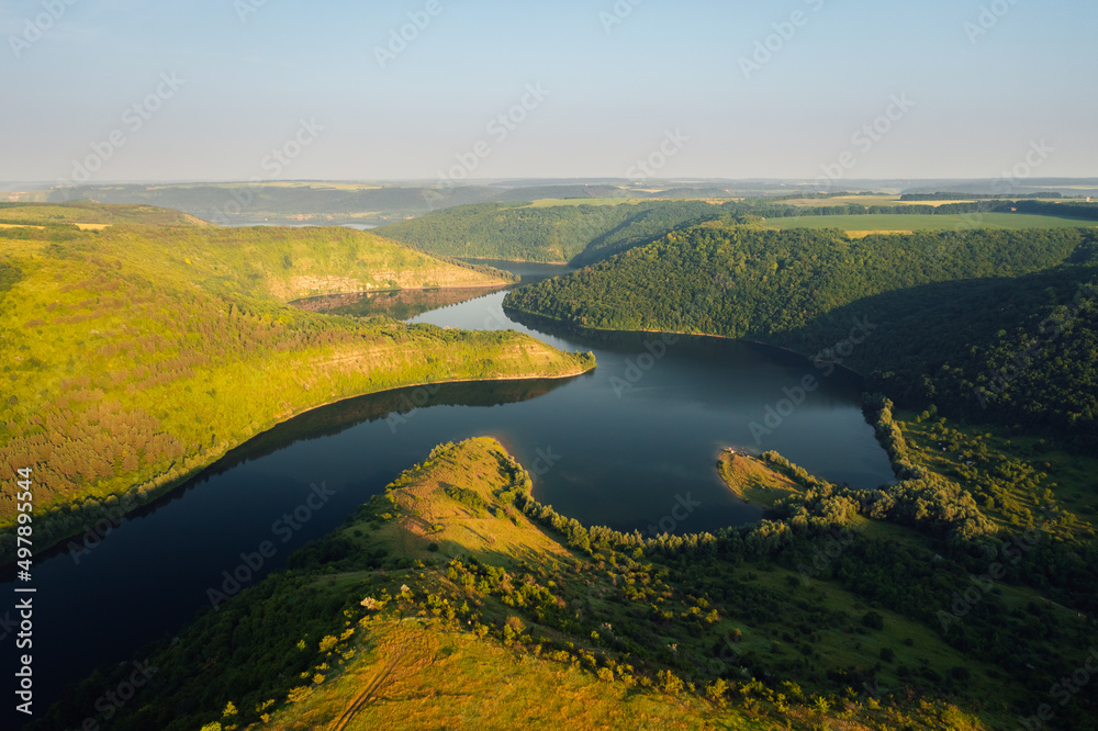 Fantastic view from a drone flying over the meander of the Dniester river. Ukraine, Europe. Fantastic view from a drone flying over the meander of the Dniester river. Ukraine, Europe.