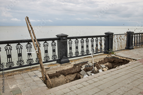 Large deep pit on the embankment of Taganrog city, Azov sea coast. Horizontal view photo