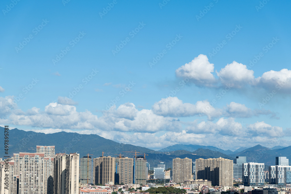 Modern city buildings under blue sky Modern city buildings under blue sky