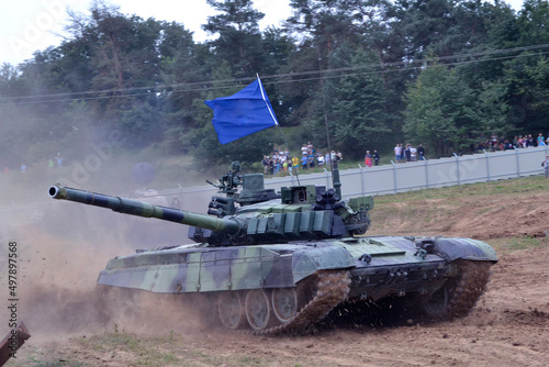Tank T72 M4 with blue flag on the battlefield