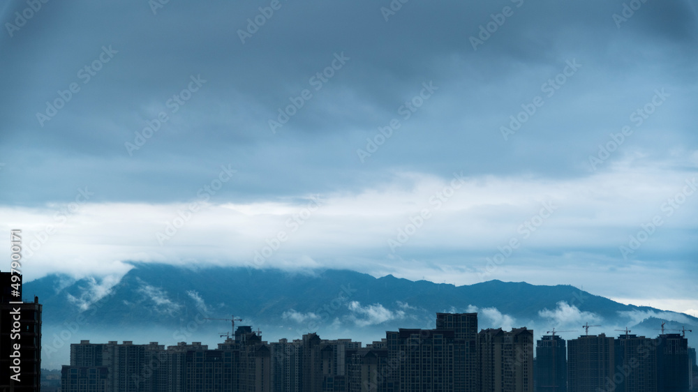 City buildings under gray sky
