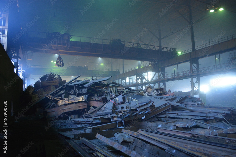 A mountain of scrap metal in the factory shop A mountain of scrap metal in the factory shop