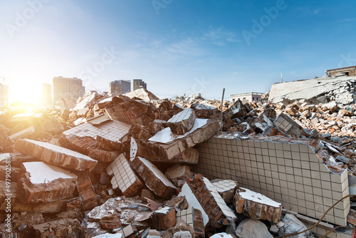 Contrast of demolished old house and modern skyscraper