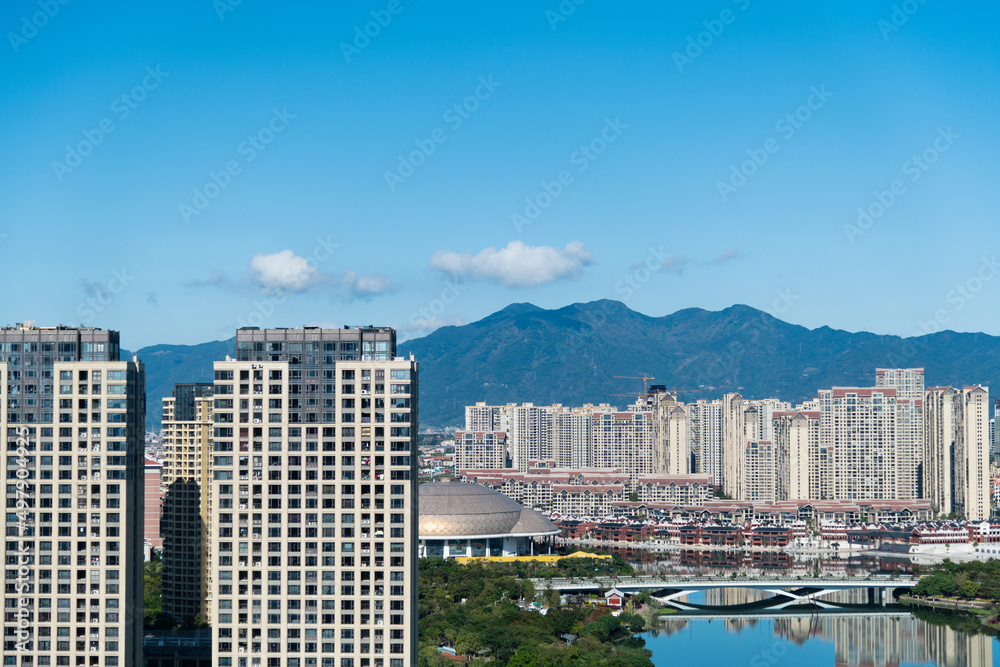Fototapeta premium City with buildings and lake