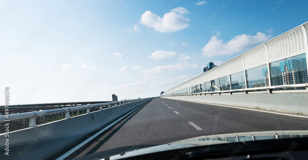 Fototapeta premium Car driving on overpass in the city