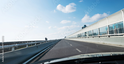 Car driving on overpass in the city