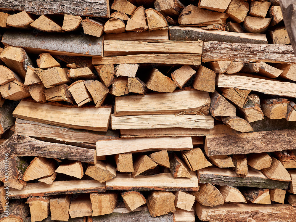 Chopped oak firewood neatly stacked Chopped oak firewood neatly stacked