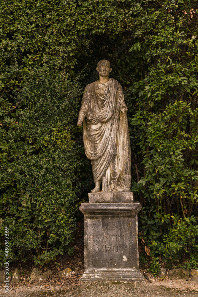 statue of a person in old Italian garden statue of a person in old Italian garden
