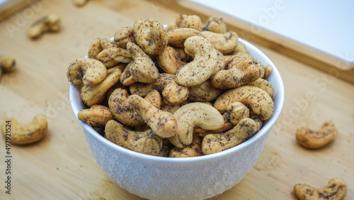 Cashew nuts. Masala flavored Kaju. Roasted Flavored Cashews or kaju. Cashews are rich in fiber, protein, and healthy fats. Kaaju is also a  commonly eaten as food in India.