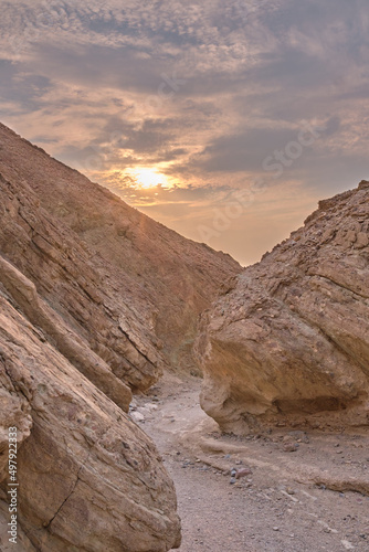 Blurred Sunset over little Canyon. Portrait Format.