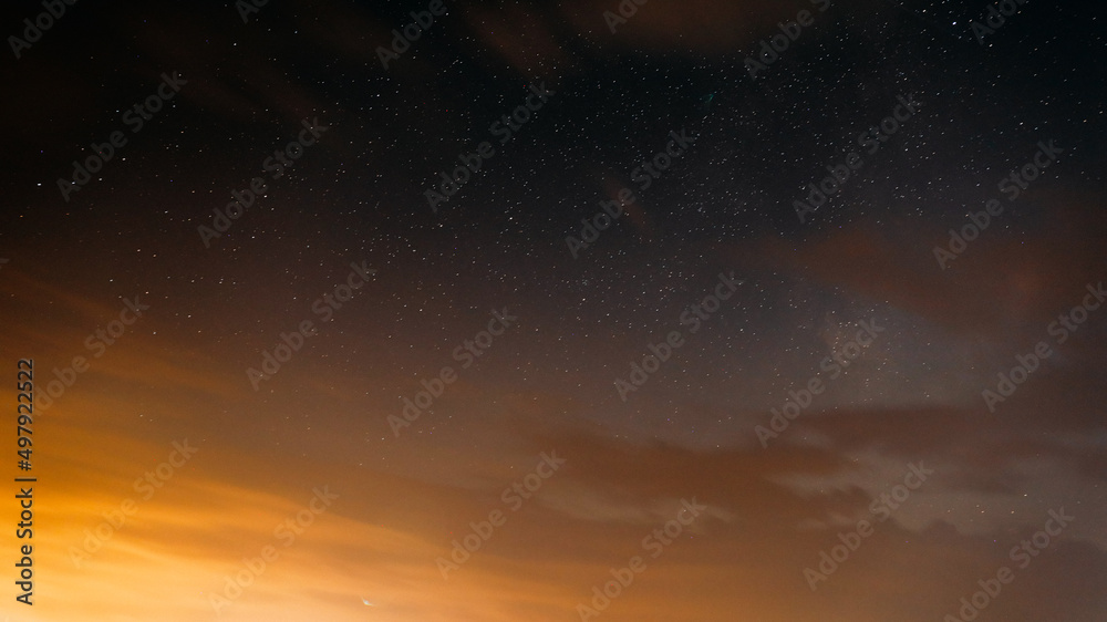 Sunset Evening Bright Sky And Glowing Stars. Natural Background Backdrop In Yellow And Black Colors. Copyspace. space stars starlight Starry sky universe panoramic view panorama.