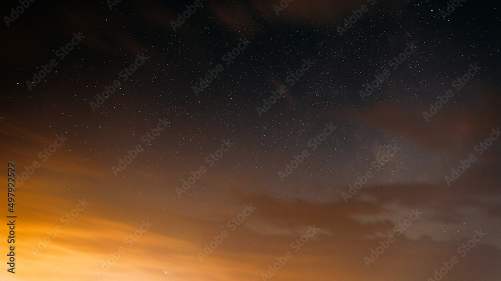 Sunset Evening Bright Sky And Glowing Stars. Natural Background Backdrop In Yellow And Black Colors. Copyspace. space stars starlight Starry sky universe panoramic view panorama. Sunset Evening Bright Sky And Glowing Stars. Natural Background Backdrop In Yellow And Black Colors. Copyspace. space stars starlight Starry sky universe panoramic view panorama.
