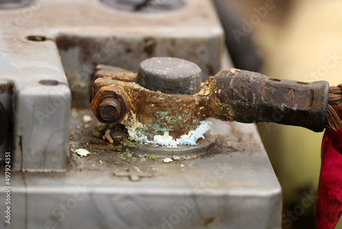 Car battery terminal covered with oxide. Car repair. Battery replacement. Selective focus.