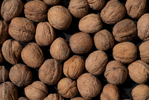 Walnuts on a dark background. Texture of walnut shell.