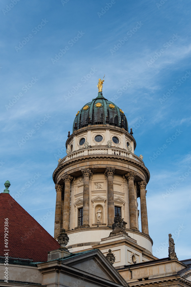 Tower of The French Cathedral (Französischer Dom) in Berlin, Germany against blue sky