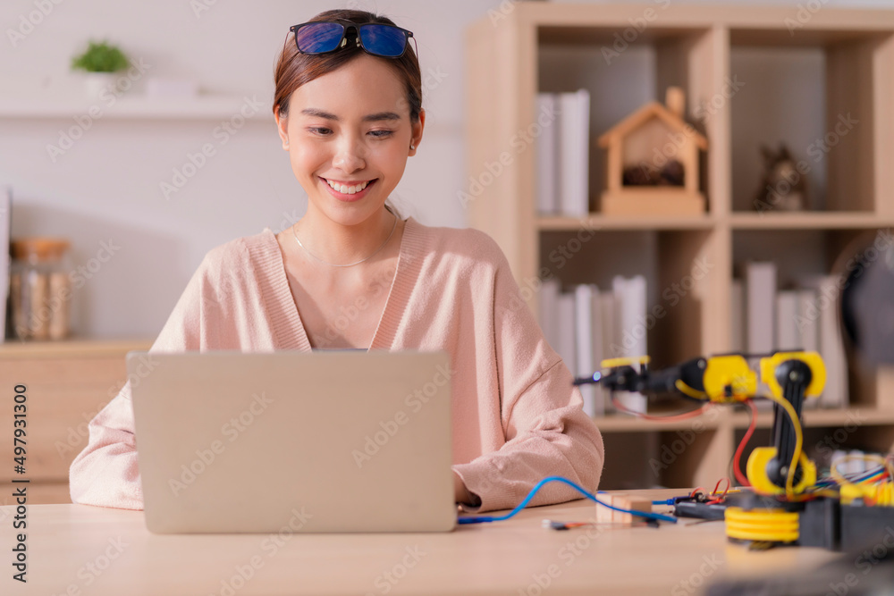 smart asian female programer learning robot arm ai coding electronic ...