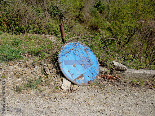 Abandoned road signs along a country road