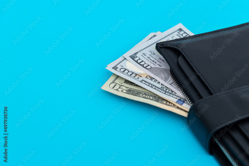Wallet with dollars on blue background Wallet with dollars on blue background