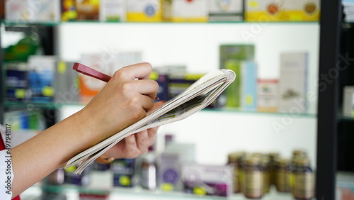 Pharmacist Woman Checking Medication Drug List Closeup