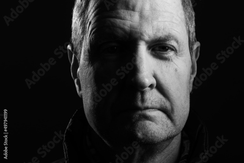 Black and white headshot of an old man with copy space  