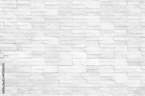 Seamless texture of white grey brick stone wall a rough surface  with space for text  for a background....