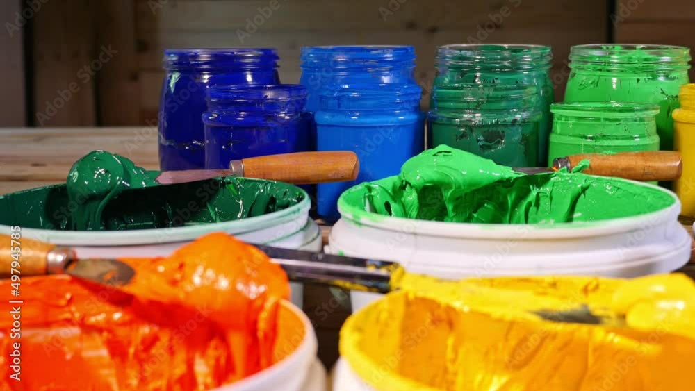 colorful of Plastisol Ink in tee shirt factory..colorful of ink in white bucket..Plastisol ink useful in tee shirt factory and in industry for export..