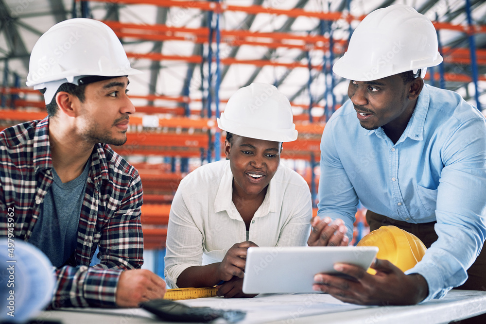 Here comes another top quality design. Shot of a group of builders having a meeting at a construction site. Here comes another top quality design. Shot of a group of builders having a meeting at a construction site.
