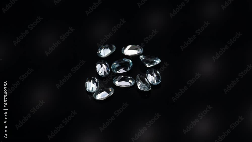 natural blue topaz gemstones on the dark background turning table natural blue topaz gemstones on the dark background turning table