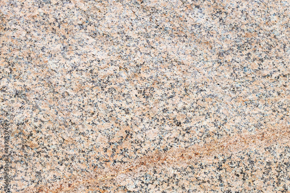 the surface of the granite texture of red color interspersed with stones the surface of the granite texture of red color interspersed with stones