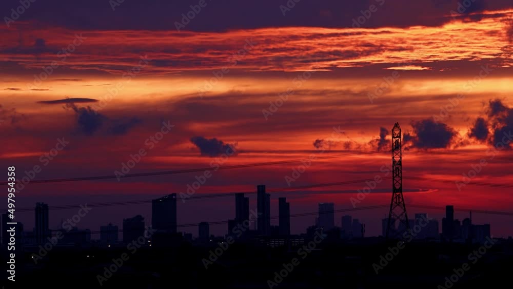 Sunset over the city with black silhouettes of buildings Sunset over the city with black silhouettes of buildings