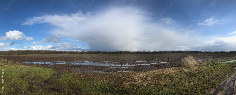 Flooding and rain shower. Uffelte Drente Netherlands. Uffelter es. Fields and clouds. Panorama. Flooding and rain shower. Uffelte Drente Netherlands. Uffelter es. Fields and clouds. Panorama.
