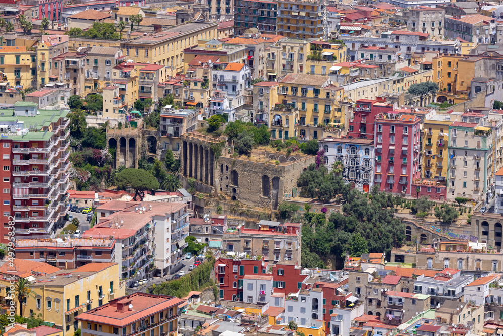 Fototapeta premium A general aerial view of the city, dense buildings, progressive urbanization of the city, Naples, Italy